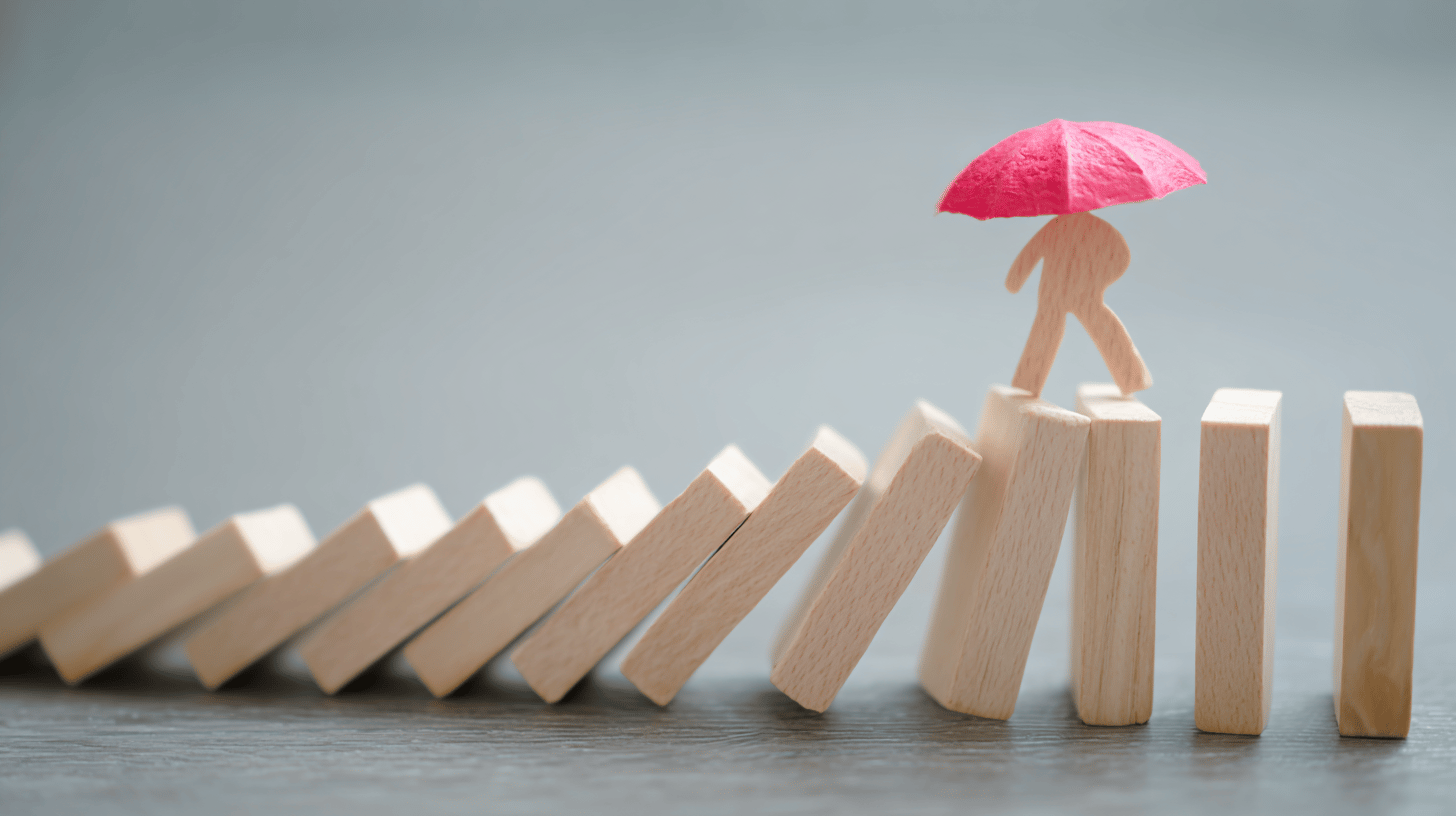 Professional discussing employee benefits risk management strategies with clients